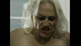 Mature Kathy Jones gets fucked in the kitchen by two dudes